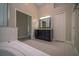 Main bathroom with double door entrance, bathtub, and separate shower stall at 19247 Otters Wick Way, Land O Lakes, FL 34638