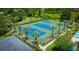 Scenic aerial view of the community's tennis courts surrounded by lush landscaping at 19247 Otters Wick Way, Land O Lakes, FL 34638