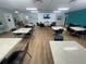 Spacious community room with tables, chairs, and a TV, perfect for social gatherings and events at 2011 58Th N Ave # 20, St Petersburg, FL 33714