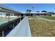 Inviting community area with benches, a shuffleboard court, and a walkway, perfect for relaxation and recreation at 2011 58Th N Ave # 20, St Petersburg, FL 33714