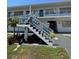 Charming two-story apartment complex with well-maintained grounds, stairs to second level, and a tropical palm tree at 2011 58Th N Ave # 20, St Petersburg, FL 33714