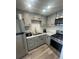 Modern kitchen featuring stainless steel appliances, gray cabinets, and ample counter space perfect for cooking at 2011 58Th N Ave # 20, St Petersburg, FL 33714