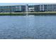 Scenic water view featuring a fountain with condominium buildings and landscaping in the background at 2011 58Th N Ave # 20, St Petersburg, FL 33714