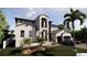 Charming two-story house boasting lush landscaping, covered entry, and a convenient two-car garage at 2019 Illinois Ne Ave, St Petersburg, FL 33703