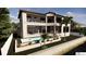 Beautiful backyard with a pool, outdoor seating, a waterfront view, and second story balcony at 2019 Illinois Ne Ave, St Petersburg, FL 33703