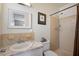 Well-lit bathroom with a shower, a vanity with a marble countertop, and modern fixtures at 2048 64Th S Ave, St Petersburg, FL 33712