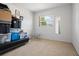 Bright, carpeted bedroom with a window and mirror offers a versatile space for relaxation and personalization at 2048 64Th S Ave, St Petersburg, FL 33712