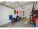 Garage featuring storage, washer, dryer, motorcycle, and ample space for vehicles or hobbies at 2048 64Th S Ave, St Petersburg, FL 33712