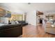 Bright and airy living room with hardwood floors seamlessly connecting to the kitchen and dining area at 2048 64Th S Ave, St Petersburg, FL 33712