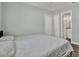 Spacious bedroom with two closets, pale green walls, and a glimpse into the bathroom at 2107 W Carmen St, Tampa, FL 33606