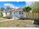 Charming single-story home with a covered porch and well-maintained front yard at 2107 W Carmen St, Tampa, FL 33606