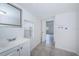 Bathroom with tile floor, a vanity and a mirror, with washer and dryer hookups available at 2443 2Nd S Ave, St Petersburg, FL 33712