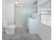 Tiled bathroom featuring a walk-in shower and modern vanity with mirror at 2443 2Nd S Ave, St Petersburg, FL 33712