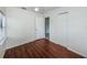 Bedroom with hard wood flooring and a white ceiling fan, with view to the exterior at 2443 2Nd S Ave, St Petersburg, FL 33712