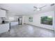 Bright kitchen featuring stainless steel appliances, white cabinetry, and stone countertops at 2443 2Nd S Ave, St Petersburg, FL 33712