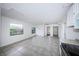 Spacious room with tile flooring, a ceiling fan, and neutral paint, ready for personalization at 2443 2Nd S Ave, St Petersburg, FL 33712