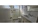 Nicely updated bathroom with glass-enclosed shower, bright vanity, and elegant fixtures at 2468 Florentine Way # 26, Clearwater, FL 33763
