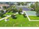 Aerial view of the community park with walking paths, picnic tables, parking, and shuffleboard courts at 2468 Florentine Way # 26, Clearwater, FL 33763