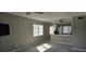Living room featuring gray walls, a ceiling fan, and laminate flooring at 2468 Florentine Way # 26, Clearwater, FL 33763