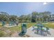Park-like green space with walking trails, picnic tables, and well-maintained landscaping at 2468 Florentine Way # 26, Clearwater, FL 33763