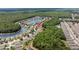 Aerial shot captures a peaceful residential area, surrounded by verdant trees and waterways at 25332 Lexington Oaks Blvd, Wesley Chapel, FL 33544