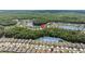 Expansive aerial image showing a community with abundant trees and tranquil ponds at 25332 Lexington Oaks Blvd, Wesley Chapel, FL 33544