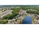 Aerial view reveals a community bordered by trees, and serene lakes at 25332 Lexington Oaks Blvd, Wesley Chapel, FL 33544