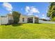 Well-maintained backyard with a screened lanai and plenty of green space at 25332 Lexington Oaks Blvd, Wesley Chapel, FL 33544