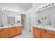 Bright bathroom with double vanity and tile floors at 25332 Lexington Oaks Blvd, Wesley Chapel, FL 33544