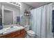Well-lit bathroom with a single sink vanity and coastal-themed decorations at 25332 Lexington Oaks Blvd, Wesley Chapel, FL 33544