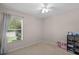 Bright bedroom with a window view, carpet floors, and simple decor at 25332 Lexington Oaks Blvd, Wesley Chapel, FL 33544