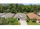 Charming home with a well-manicured lawn and mature trees in a desirable neighborhood at 25332 Lexington Oaks Blvd, Wesley Chapel, FL 33544