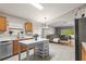 Open-concept kitchen featuring a center island with a view into the living room at 25332 Lexington Oaks Blvd, Wesley Chapel, FL 33544