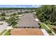 Aerial view of single-Gathering homes showing roofs, backyards, and a community pond at 25332 Lexington Oaks Blvd, Wesley Chapel, FL 33544