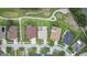 An aerial view of homes nestled next to a lush green golf course, offering a serene and picturesque neighborhood at 25942 Risen Star Dr, Wesley Chapel, FL 33544