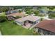 Aerial view of a backyard with a deck and a screened-in patio at 25942 Risen Star Dr, Wesley Chapel, FL 33544
