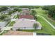 Aerial view of a home in a neighborhood near a golf course at 25942 Risen Star Dr, Wesley Chapel, FL 33544