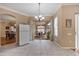 Bright dining room boasts tile floors and access to a screened-in lanai at 25942 Risen Star Dr, Wesley Chapel, FL 33544