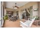Spacious screened lanai includes a dining set and swing for outdoor enjoyment at 25942 Risen Star Dr, Wesley Chapel, FL 33544