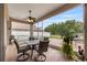 Relaxing screened lanai offers comfortable seating and views of the backyard at 25942 Risen Star Dr, Wesley Chapel, FL 33544