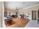 Inviting living space with hardwood floors, piano, fireplace and comfortable furnishings at 25942 Risen Star Dr, Wesley Chapel, FL 33544