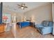 Spacious main bedroom with access to ensuite bathroom and sliding door to the lanai at 25942 Risen Star Dr, Wesley Chapel, FL 33544