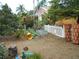 Backyard featuring garden beds, white picket fence, and stackable planter pots at 2624 54Th S St, Gulfport, FL 33707