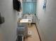 Compact bathroom with accessible features, including grab bars and hand sanitizer at 2624 54Th S St, Gulfport, FL 33707