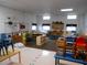 Well-lit interior featuring organized learning areas, educational displays, neutral walls, and tile flooring at 2624 54Th S St, Gulfport, FL 33707