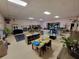 Bright interior space with learning areas, toys, neutral walls, tile floor and ample commercial lighting at 2624 54Th S St, Gulfport, FL 33707