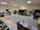 Spacious interior area with neutral walls, commercial lighting, and a light-colored rug in a learning environment at 2624 54Th S St, Gulfport, FL 33707