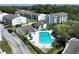 Scenic aerial view of the community featuring a refreshing pool and well-maintained apartment buildings at 2625 State Road 590 # 2832, Clearwater, FL 33759