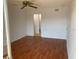 Bright bedroom with sleek hardwood floors, fresh paint, and ample natural light at 2625 State Road 590 # 2832, Clearwater, FL 33759