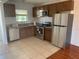 Functional kitchen featuring stainless steel appliances, ample cabinet space, and tile flooring at 2625 State Road 590 # 2832, Clearwater, FL 33759